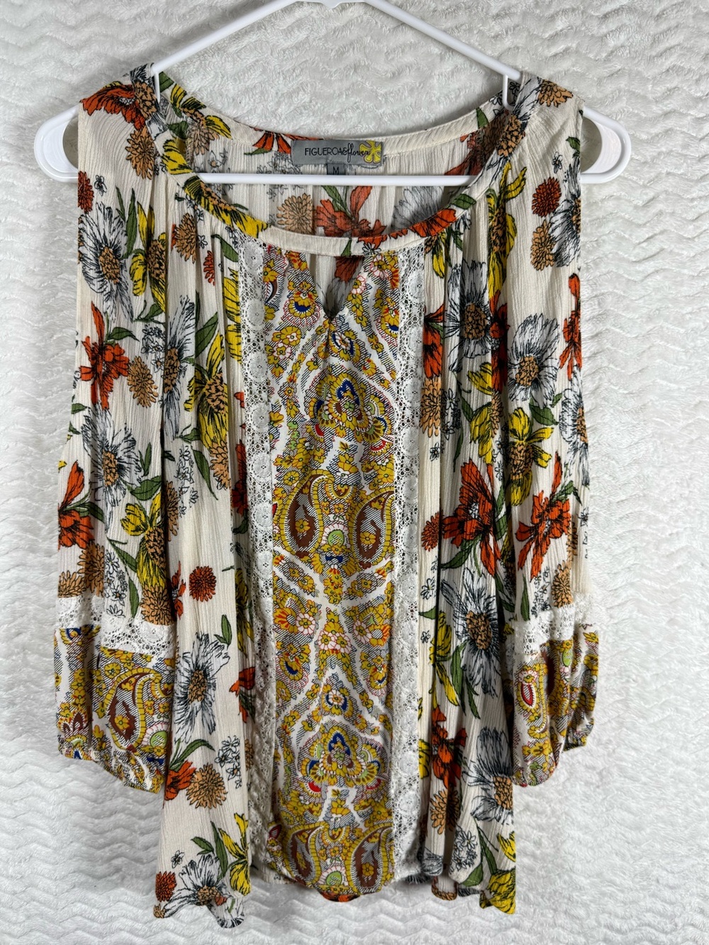 Fig and Flower blouse features a vibrant, multicolor floral print & lace